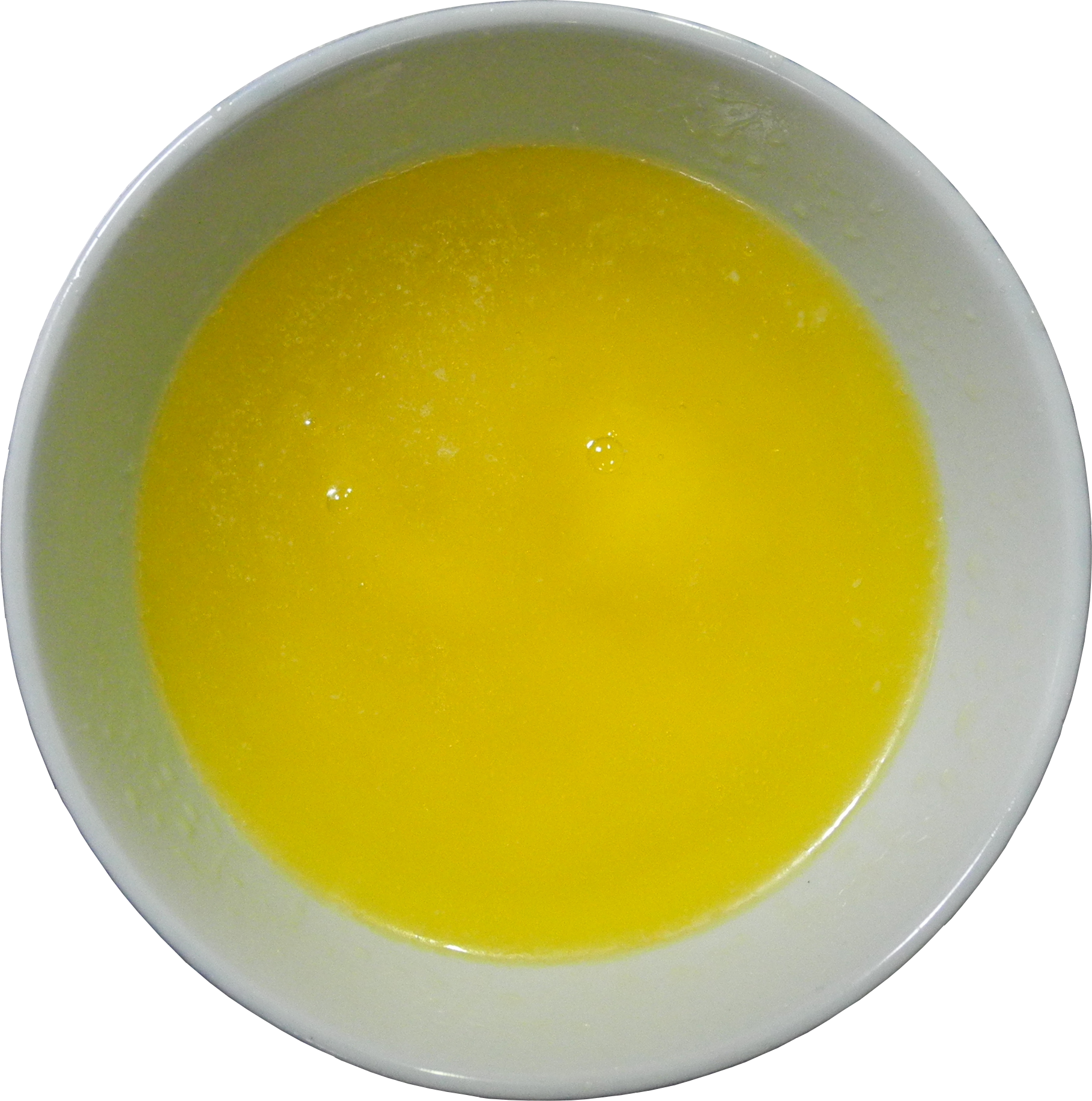 A Bowl Of Yellow Liquid