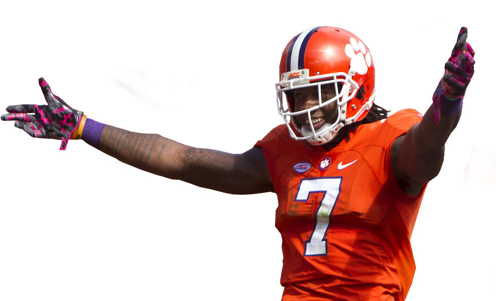 A Football Player In Orange Uniform With His Arm Out