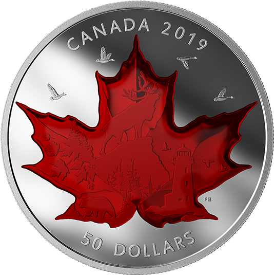 A Silver Coin With A Red Maple Leaf