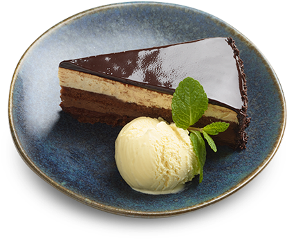 A Slice Of Chocolate Cake With Ice Cream On A Blue Plate