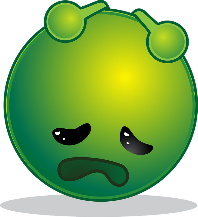 A Green Round Object With A Sad Face