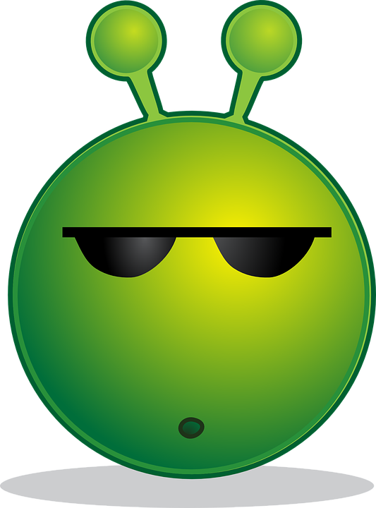 A Green Alien Face With Sunglasses
