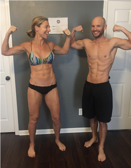 A Man And Woman Flexing Their Muscles
