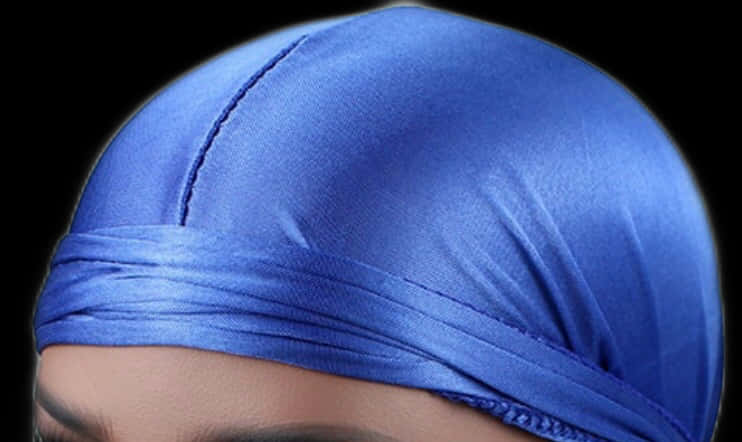 A Close Up Of A Blue Head Wrap