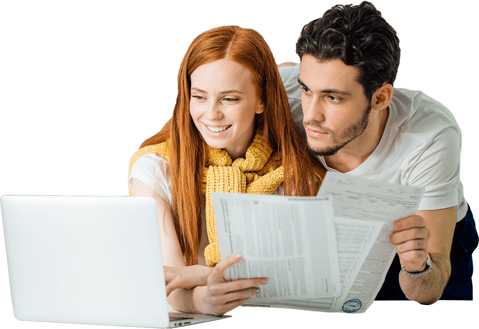 A Man And Woman Looking At Papers