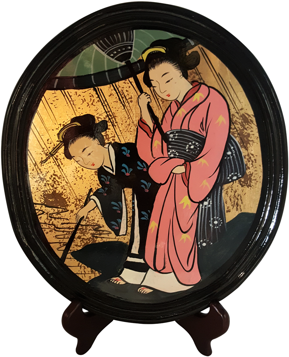 A Round Plate With A Painting Of Two Women