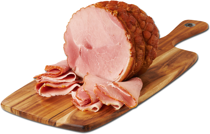 A Sliced Ham On A Wooden Board