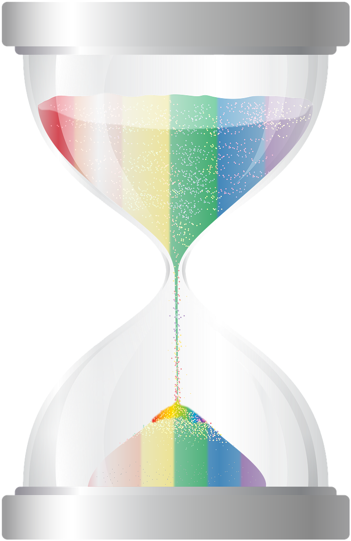 A Rainbow Colored Sand Running Through A Hourglass