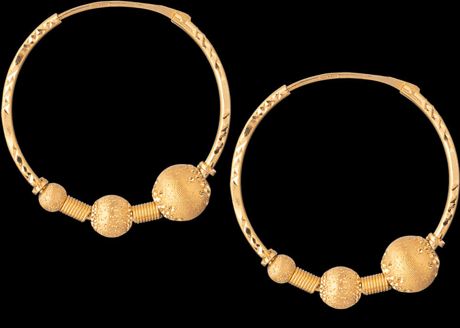 A Pair Of Gold Hoop Earrings