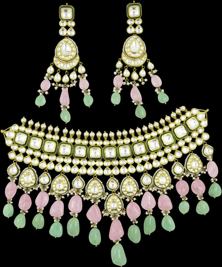 A Necklace And Earrings With Stones And Crystals