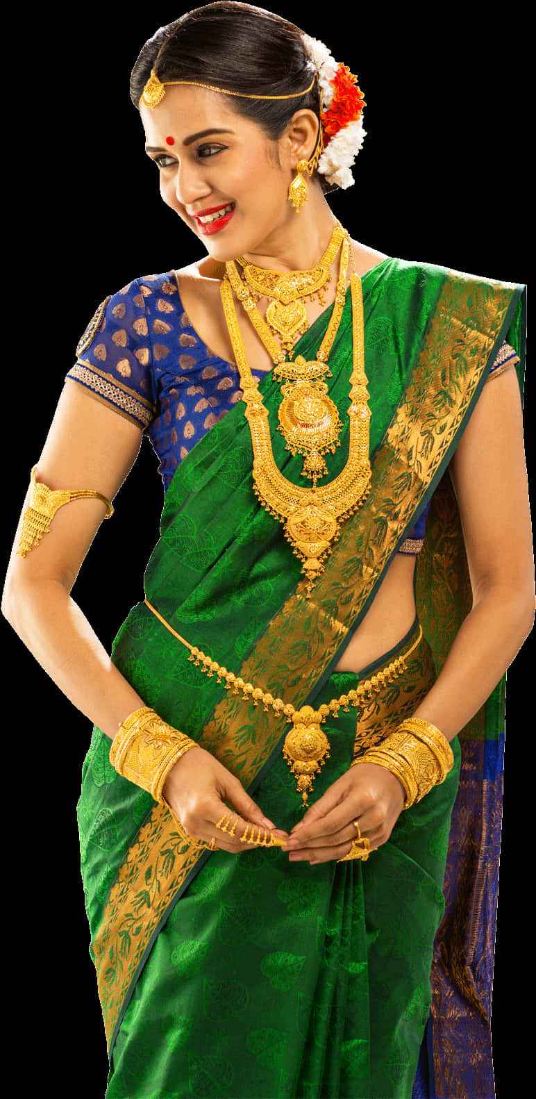 A Woman Wearing A Green And Gold Sari