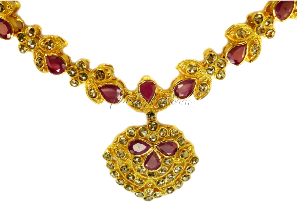 A Gold Necklace With Red Stones