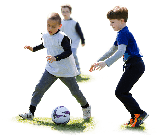 A Group Of Boys Playing Football