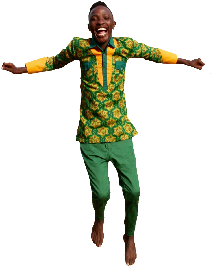 A Man In Green And Yellow Shirt Jumping With Arms Outstretched