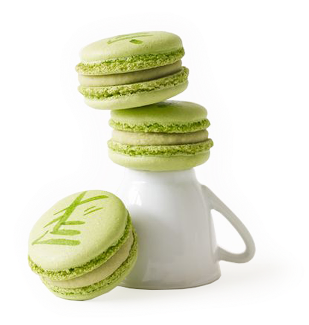 A Stack Of Green Cookies On A White Cup