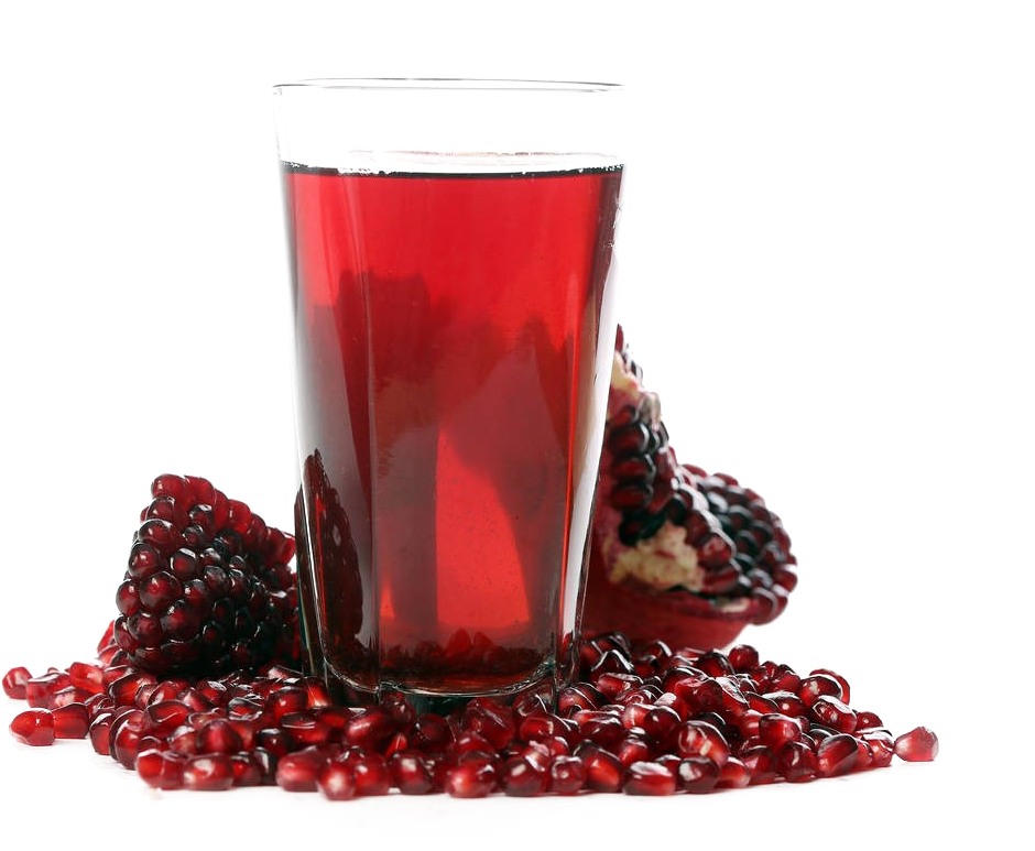 A Glass Of Red Juice And Pomegranate Seeds