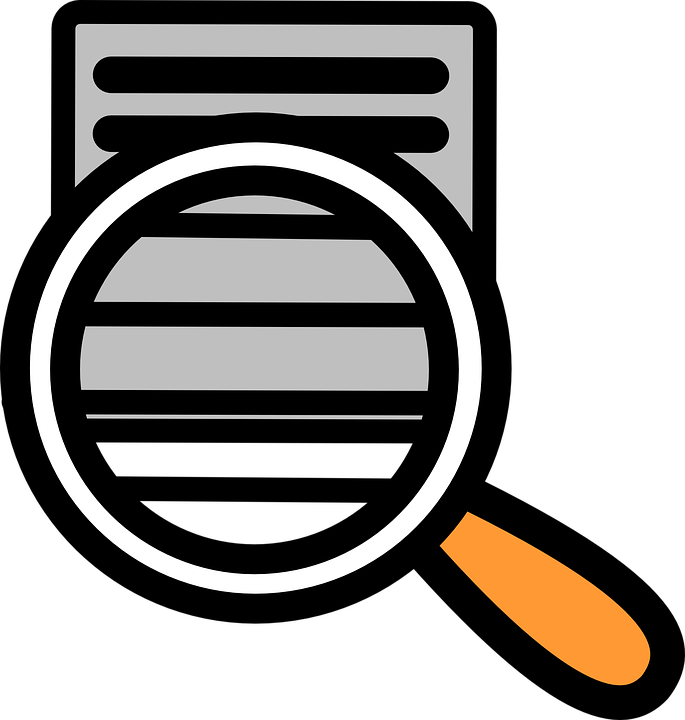 A Magnifying Glass Over A Computer