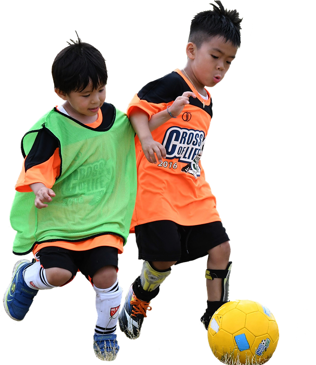 Two Boys Playing Football