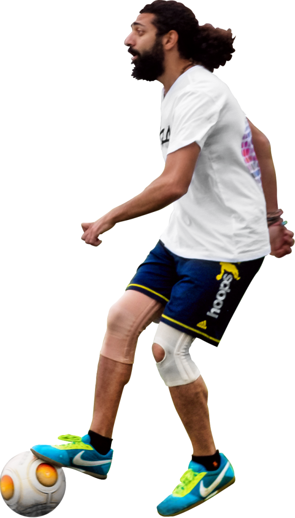 A Man Wearing A White Shirt And Blue Shorts