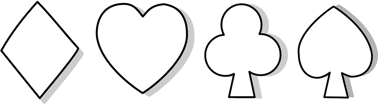 A Close-up Of A Heart And A Card Suit