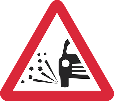 A Red Triangle Sign With A Black And White Image