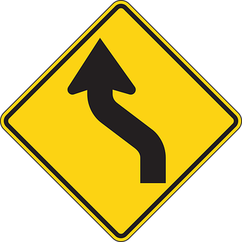 A Yellow Road Sign With A Black Arrow