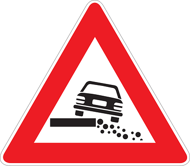 A Red Triangle Sign With A Car Falling Off A Ledge