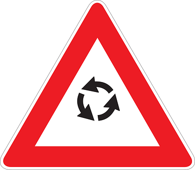 A Red And White Triangle Sign With Black Arrows