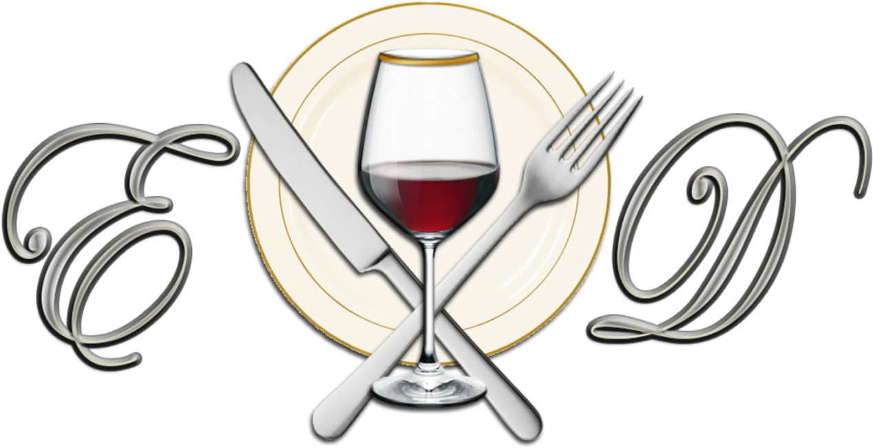 A Plate With A Glass Of Wine And Knife And Fork