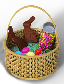 A Basket Full Of Candy And Chocolate Bunnies