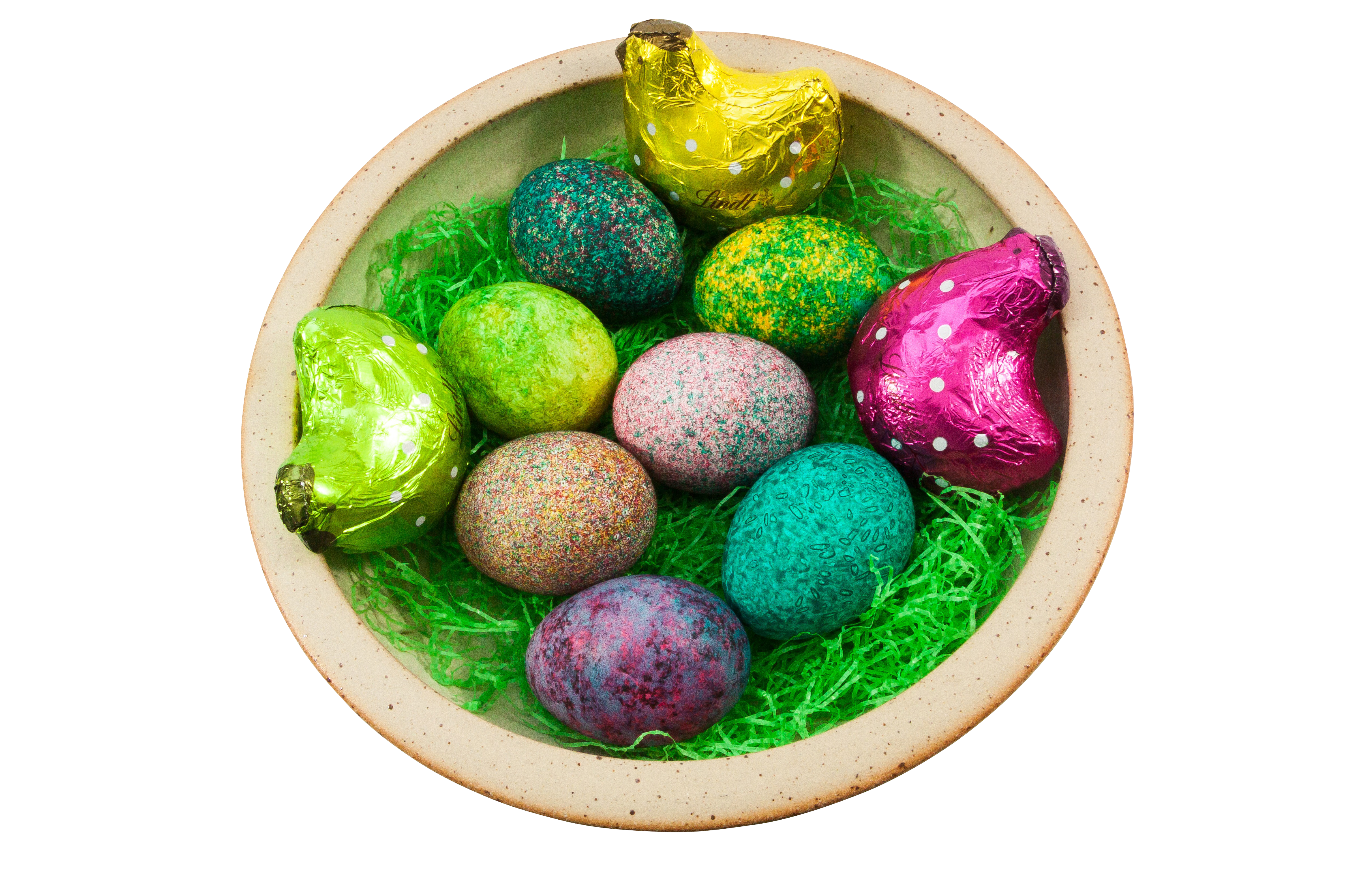 A Bowl Of Colorful Eggs And Candy