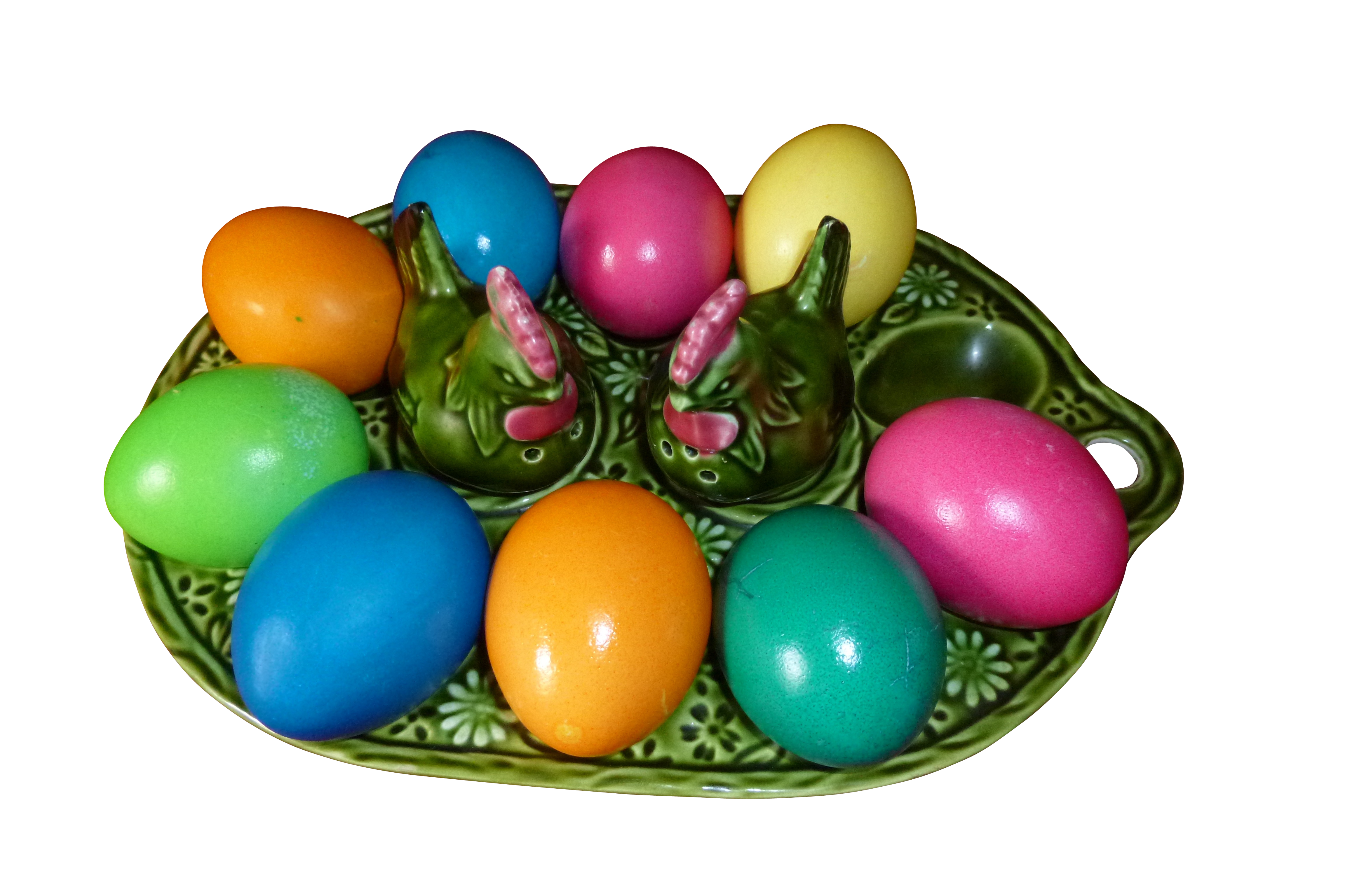 A Plate With Colorful Eggs And Ceramic Chicken