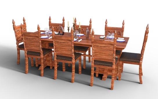 A Table Set With Chairs And Candles