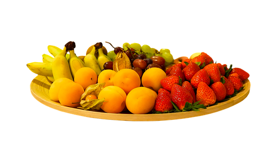A Plate Of Fruit On A Black Background