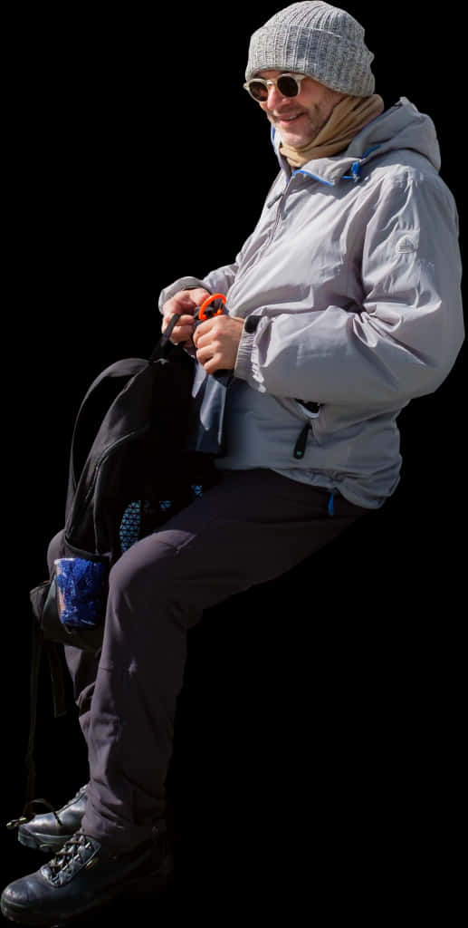 A Man Holding A Backpack