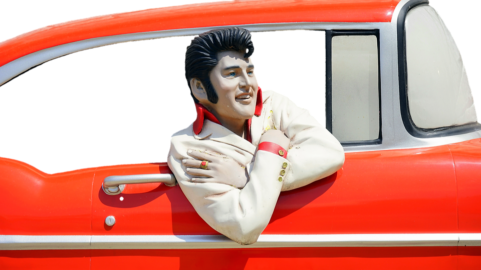 A Statue Of A Man In A Car