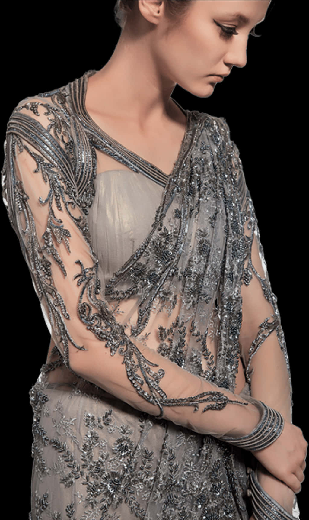 A Woman Wearing A Silver Dress