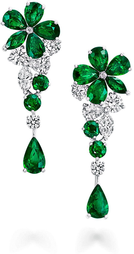 A Pair Of Earrings With Green And White Diamonds