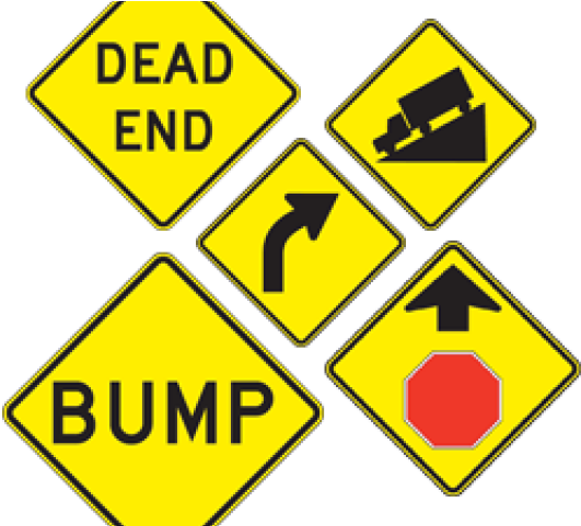 A Group Of Yellow Road Signs
