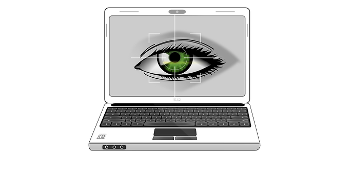 A Laptop With A Green Eye On The Screen