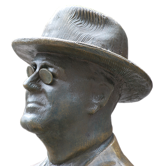 A Statue Of A Man Wearing A Hat And Sunglasses