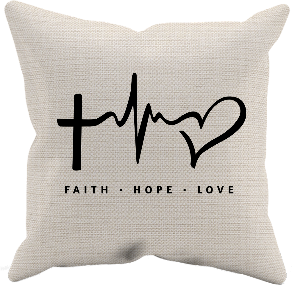 A White Pillow With A Heart And A Cross On It