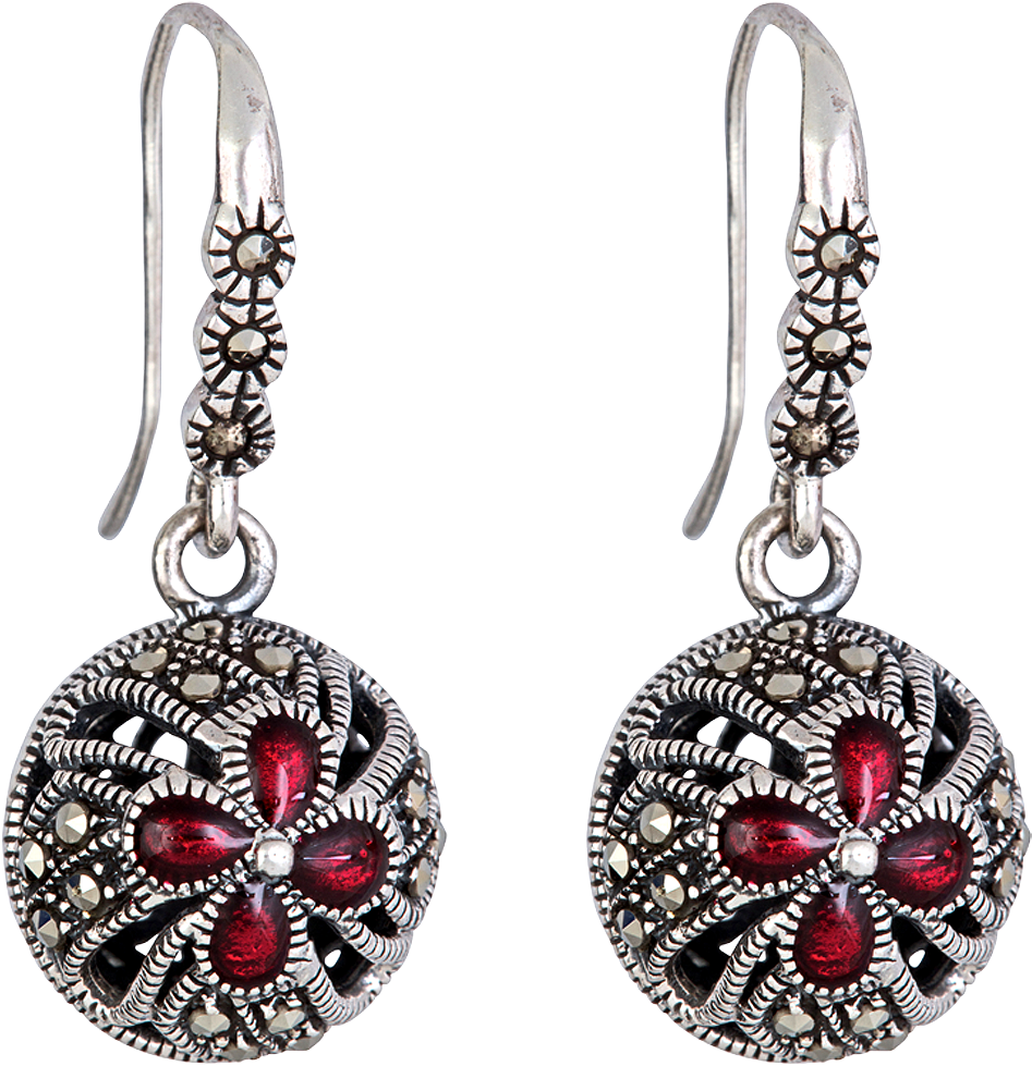 A Pair Of Earrings With Red Stones