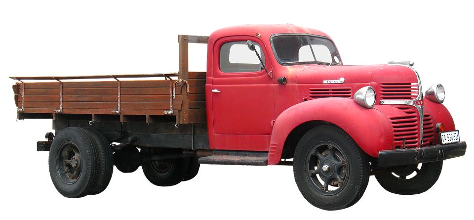 A Red Truck With A Wooden Bed