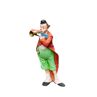 A Statue Of A Clown Playing A Trumpet
