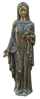 A Statue Of A Woman Holding Flowers