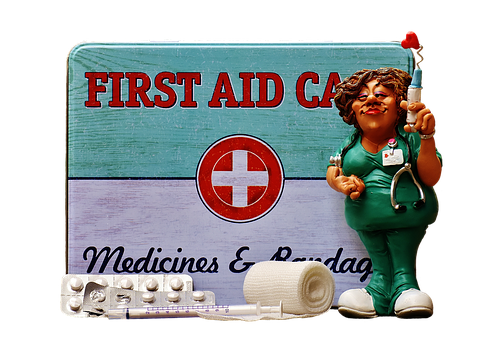 A First Aid Kit With A Figurine And Syringes