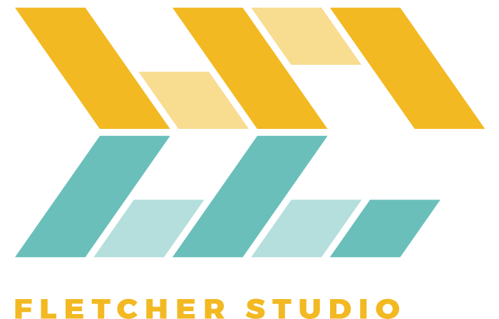 A Logo With Yellow Blue And Black Squares