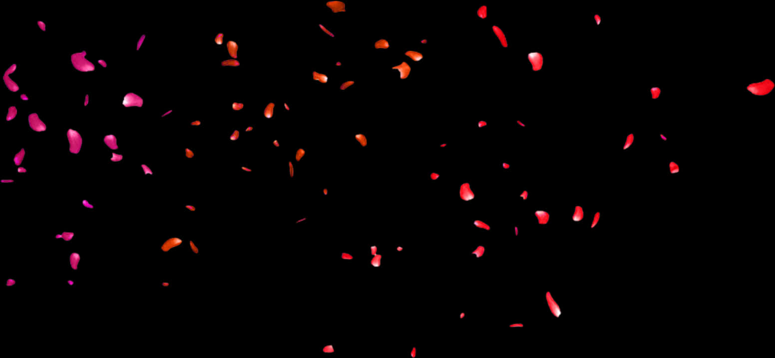 A Group Of Red Petals Flying In The Air
