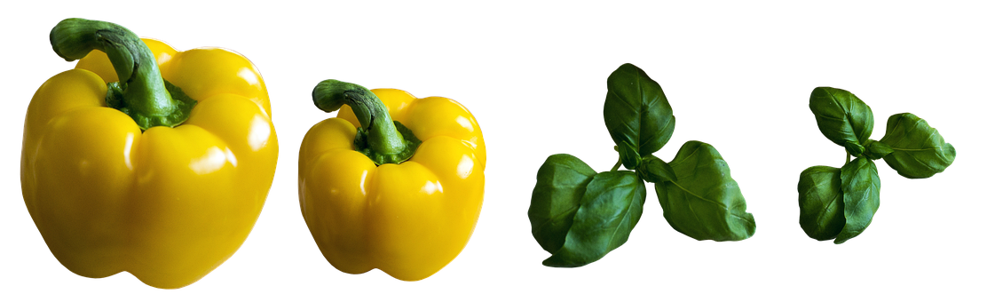 A Yellow Bell Pepper And A Green Leaf